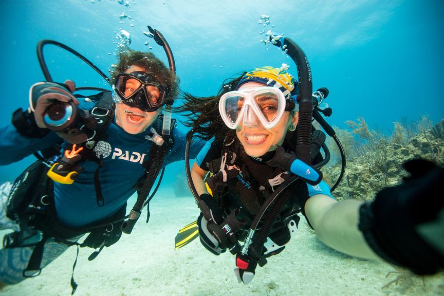 Two divers taking a selfie underwater